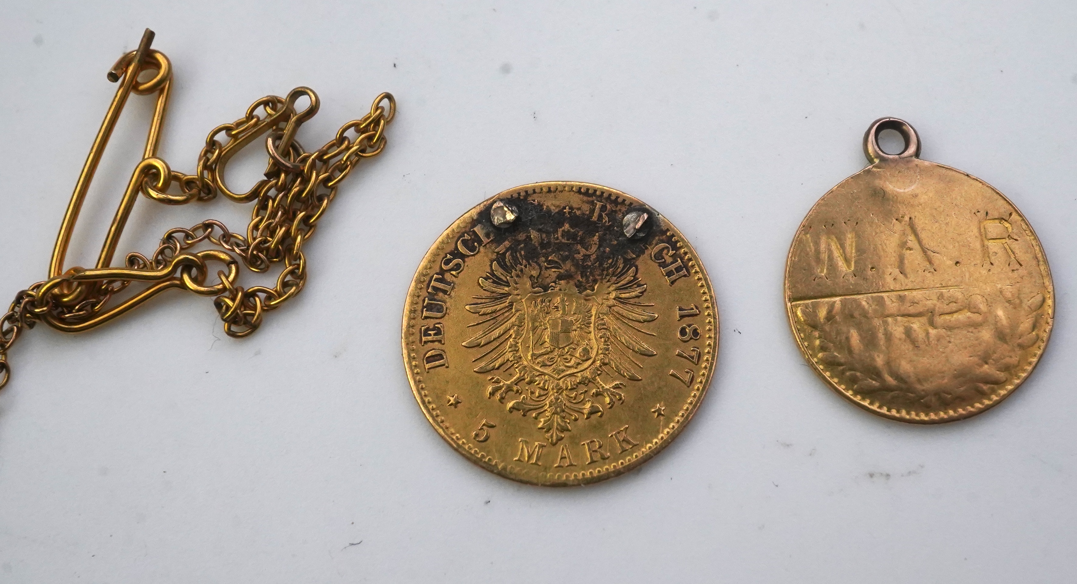 Seven assorted mounted or drilled gold coins